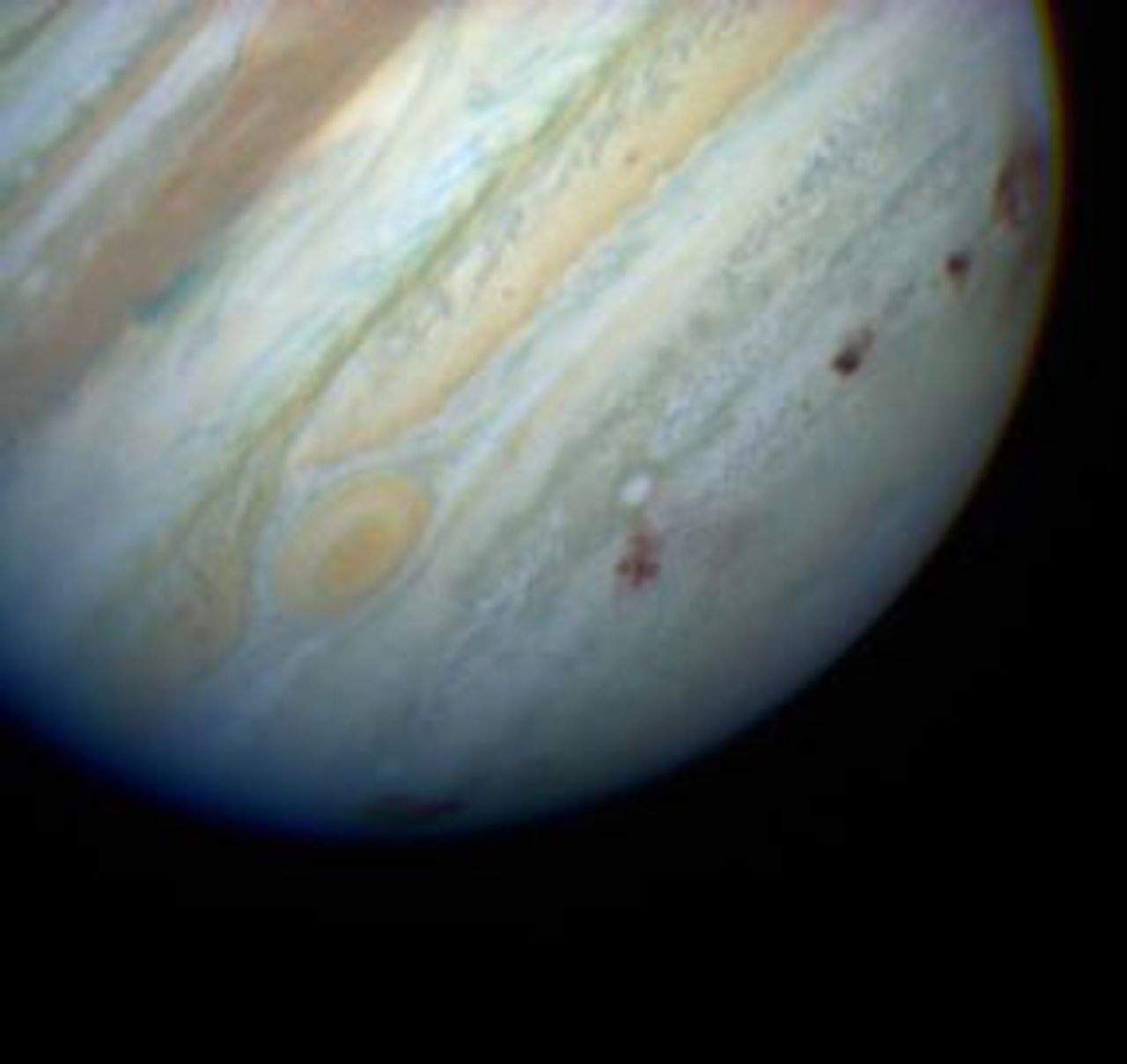 Comet Shoemaker-Levy impacting Jupiter